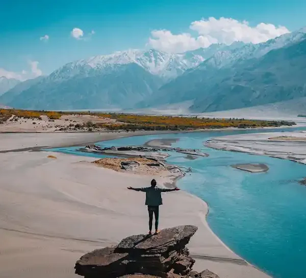Travelling - Man standing on rock