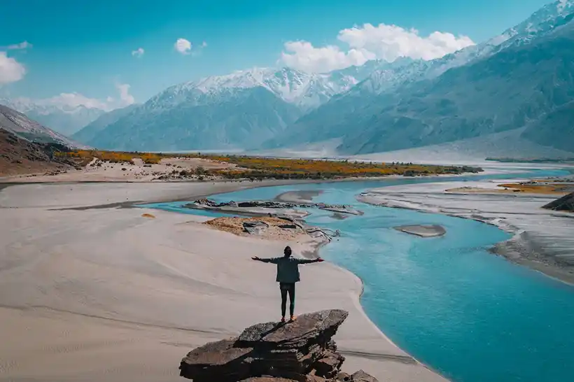 Travelling - Man standing on rock