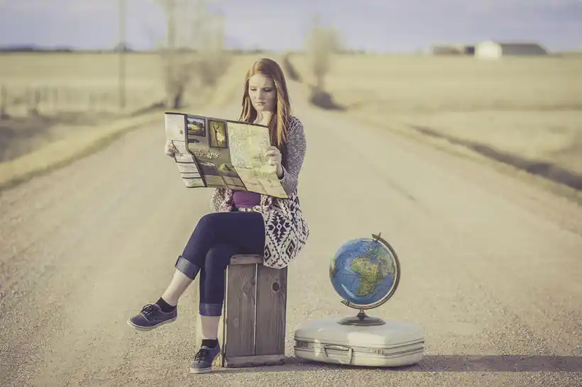 Travelling - woman checking map