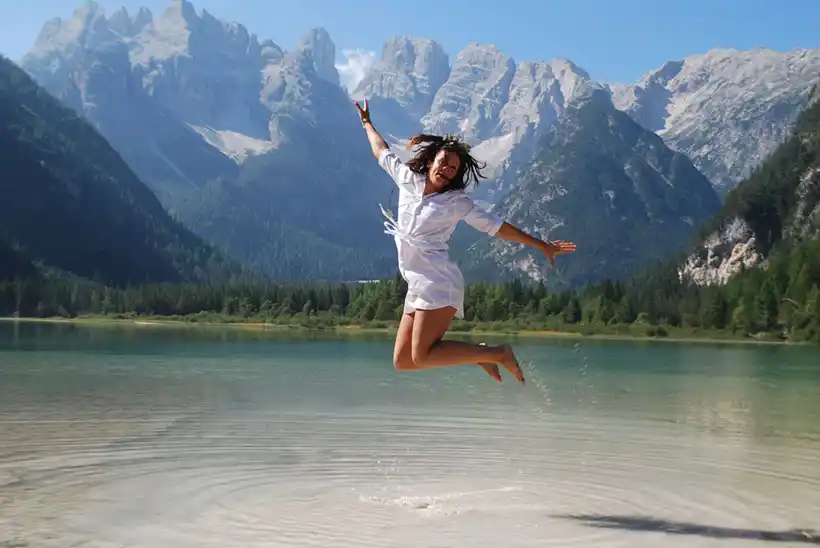 Travelling - a girl jumping in water 